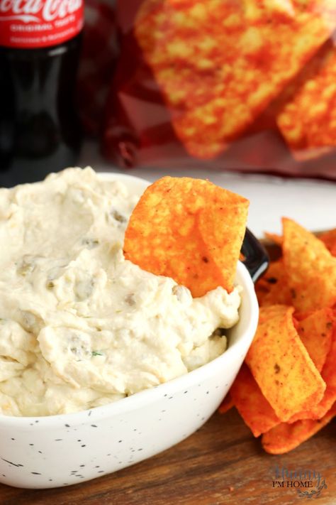 When it comes to easy recipes for a party, it doesn't get much better than this Doritos dip! It's made with cream cheese and green chilies, making it a creamy cheese dip perfect for Nacho flavored tortilla chips! Make it in the slow cooker or eat it cold. Dip For Doritos, Doritos Dip, Creamy Cheese Dip, Dorito Dip, Slow Cooker Dips, Dip For Tortilla Chips, Best Dip Recipes, Nacho Chips, Green Chiles