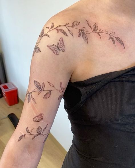 leafy vibe wrap with some dainty butterflies & her daughter’s birthday 🌿🦋 appointment type: half day session • • • #utahtattooartist… | Instagram Shoulder Sleeves For Women Tattoo, Flower Butterfly Wrap Around Tattoo, Leaf Vine Sleeve Tattoo, Shoulder Arm Wrap Tattoo, Butterflies Wrapped Around Arm Tattoo, Dainty Floral Arm Wrap Tattoo, Leaves Wrapped Around Shoulder Tattoo, Leaf And Butterfly Tattoo, Leafy Arm Wrap Tattoo