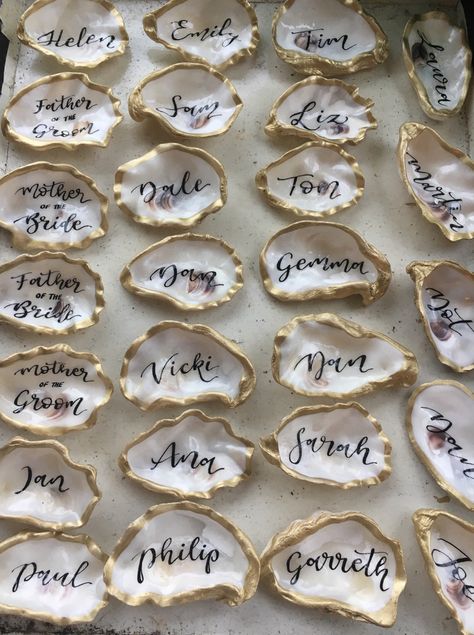 Oyster Place Setting, Shell Party Decorations, Beach Dinner Party Table, Wedding Shell Decor, Beach Rehearsal Dinner Decorations, Oyster Party Decorations, Oysters At Wedding, Elegant Beach Bridal Shower Ideas, Oyster Shell Place Setting