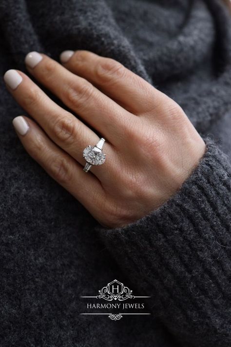 #ovaldiamondring #ovaldiamondengagementring #diamondengagementring #londonjewellery #custommade #harmonyjewelsldn Oval Diamond With Baguette Side Stones, Oval With Tapered Baguettes, Oval Tapered Baguette Engagement Ring, Oval Baguette Engagement Ring, Oval With Baguettes Ring, Oval Engagement Ring With Baguettes, 2ct Oval Engagement Ring, Oval Engagement Ring Platinum, White Gold Oval Engagement Ring