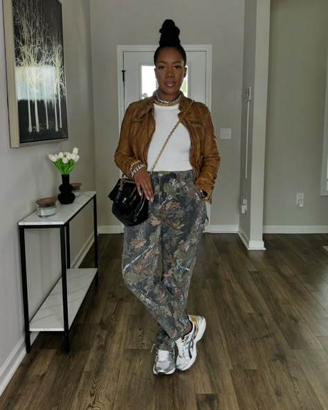 ~Recap of the OOTD~ Camo season! Swipe to see the look styled with sneakers as well. Watch the previous reel for step by step details! 🤎🍂🍁🍃🌳 . 📌Shop the look on my @shop.ltk page linked in my bio. . ✨What I’m wearing: *Leather jacket: @freepeople *Tank top: @macys *Pants: @abercrombie. These are men’s pants. I’m wearing a size 32x32. They’re linked on my LTK. *Purse: @balenciaga *Necklaces and bracelets: @imanijewelryco *Earrings: @etsy *Heels: @aldo_shoes *Sneakers: @asics via @stockx ... Sweater With Sneakers Outfit, Wide Cargo Pants Outfit, Casual Outfits With Sneakers, Style Camo Pants, Purse Balenciaga, Camo Jacket Outfit, Macys Pants, Camo Pants Outfit, Comfy Outfits Winter