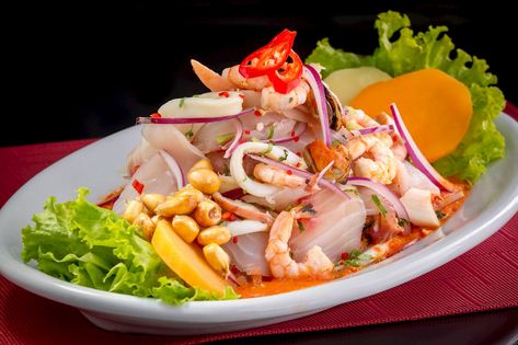 Ceviche Mixto | Traditional Seafood From Peru | TasteAtlas Citrus Marinade, Hot Corn, Ceviche Recipe, Tapas Dishes, Peruvian Recipes, Cooking Seafood, Fat Foods, Food Out, Spicy Sauce