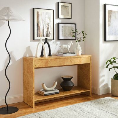 Discover the simplicity and allure of the Hudson Console Table. Featuring a minimalist design, this stylish wood console table blends seamlessly into any contemporary setting. Crafted and adorned with a burl wood paper laminate, this narrow console table exudes sophistication and durability. Two full-glide drawers provide ample storage, while an open shelf below offers display space for books, magazines, or decorative items, making it a practical addition to any entryway or living room. Designed Modern Console Table With Drawers, Burl Wood Console Table, Burl Wood Console, Narrow Entryway Table, Entry Console Table, Narrow Console Table, Deck Box Storage, Modern Console Tables, Modern Console