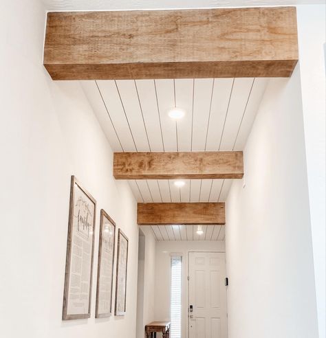 Shiplap Ceiling With Faux Beams, Beam Over Doorway, Plank And Beam Ceiling, Living Room Beam Ideas, Wood Beam Hallway, Wood Panelling Ceiling, Hallway With Wood Beams, Shiplap Ceiling Entryway, Shiplap Ceiling Vaulted With Beams