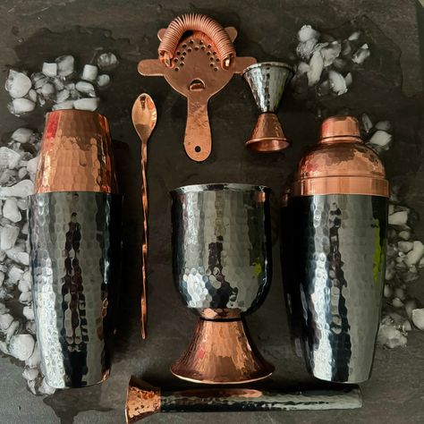 🇲🇽 100% Mexican Copper & 100% Hand Hammered: Black Nickel 7 Piece Set (also sold individually) INCLUDED: Boston Shaker 24 oz. | 6.5in. Height (large) 4.2in. Height (small) Cobbler Shaker 24 oz. | 9in Height x 3.2in. Width Mixology Bar Spoon 10in. Hawthorne Strainer 6.5in Jigger 1 oz (small) 2 oz. (large) | 3.5in. Height Cocktail Muddler 8.8in. Height Mixing Cup 20 oz. | 5.3in. Height x 3.5in. Width #bartender #cocktails #mixology #copperbar #tequila #mezcal #bartenderlife #handmade Indoor Bar Decor, Mixology Bar, Hotel Hospitality, Hey Bartender, Artisan Decor, Copper Work, Mixing Metals, Bar Keeper, Bar Sets