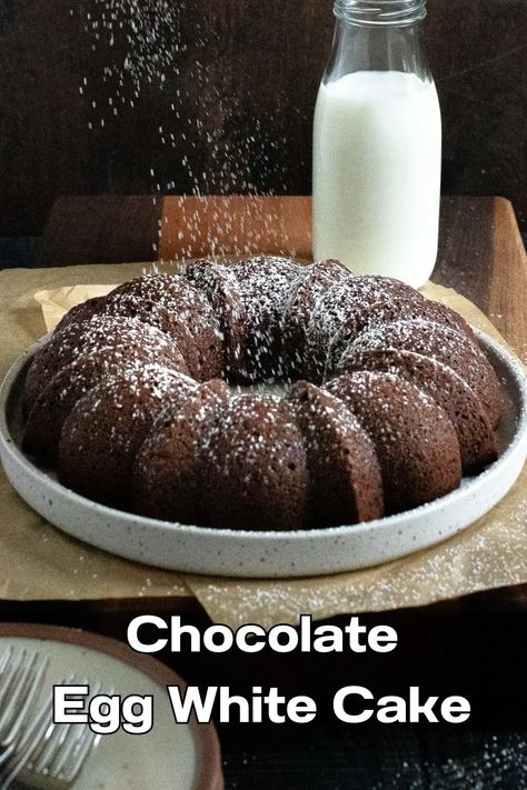 Chocolate egg white cake on plate with confectioner's sugar being sprinkled on it. Egg White Recipes Dessert, Egg White Cake, White Chocolate Mousse Cake, White Recipes, Chocolat Cake, Egg White Recipes, Cocoa Cake, White Chocolate Cake, White Cake Recipe