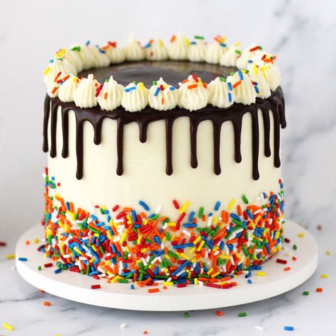 Celebrate a special birthday with this Sprinkle Birthday Cake. This deliciously moist white cake is frosted with homemade buttercream, topped with chocolate ganache drips and is decorated with lots of rainbow colored sprinkles. Boy Sprinkle Cake, Cake With Chocolates On Top, Chocolate Birthday Cake Kids, Fun Birthday Cakes, Sprinkle Birthday Cake, Sprinkle Birthday, Bolo Rapunzel, Key Lime Cupcakes, Kids Birthday Cakes