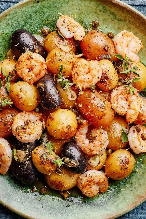 This short ingredient list features a handful of flavor powerhouses—namely garlic, oregano, capers, and lemon, which as a team can transform even the blandest proteins into a delightful meal. Here they dress quickly seared shrimp and boiled tiny potatoes to form an incredibly quick, weeknight-friendly meal. Look for peewee potatoes, which are 1½" in diameter or less and usually sold by the pound in a netted bag in the produce section. Tiny Potatoes, Seared Shrimp, Shrimp Zucchini, Fried Seafood, Tiny Potato, Greek Potatoes, Mini Potatoes, Potato Dinner, Potato Recipe