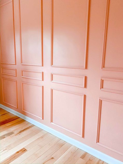 After adding peel and stick molding to a wall, a blogger painted it with Clare's rosy pink paint color, Rosé Season. #pinkpaint #wainscoting #diymolding #diyprojects #diyideas #bedroomdiy Pink Guest Room, Peel And Stick Molding, Clare Paint, Bright Laundry Room, Pink Paint Colors, Peach Walls, Hotel Chic, Picture Frame Molding, Wall Trim