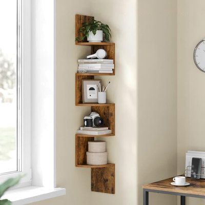 Made from high-quality materials, each of the five shelves supports up to 13.2 lbs, ideal for books, decor, or toiletries. Latitude Run® | Latitude Run® Corner Shelf Wall Mounted, 5-Level Floating Corner Bookshelf, Storage Display Shelf For Bedroom, Living Room, Bathroom | Wayfair Bookshelf For Corner Wall, Corner Shelves Living Room Modern, Tiny Room Storage Ideas, Corner Tree Bookshelf, Open Shelves Bedroom, Shelf Ideas For Bedroom, Corner Shelves Bedroom, Wooden Room Decor, Bookshelf In Bedroom