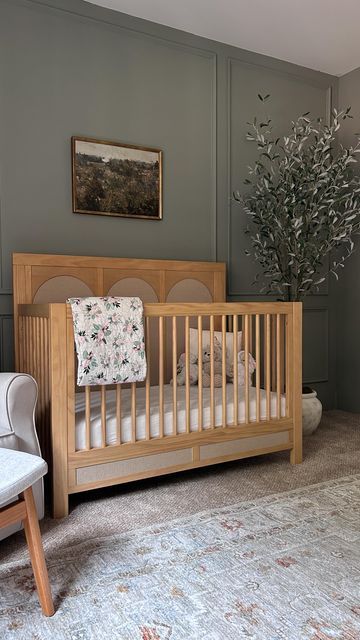 Melissa Coryell on Instagram: "Golden hour this morning with my girl ☀️ Comment SHOP to get a link sent to your DMs with all the details for our nursery - Follow @interiors.bymel for more neutral, classic, modern home design inspo - You can also shop my home using the LTK app 📱 #nursery #nurseryinspo #nurseryinspiration #namesake #ａｅｓｔｈｅｔｉｃ #babycrib #babygirl #wayfair #target #targetstyle #studiomcgee A68" Oak Crib Nursery Ideas, Namesake Nursery, Studio Mcgee Nursery, Green Baby Nursery, Sage Green Nursery, Gender Neutral Baby Room, Modern Baby Nursery, Nursery Decor Green, Baby Barn