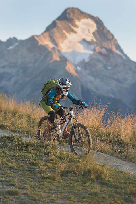 Woman wearing helmet and backpack riding mountain bike downhill singletrack on the alpine backcountry route Mountain Bike Aesthetic, Biking Aesthetic, Mountain Biking Women, Portrait Of Woman, Bike Aesthetic, Instagram Grid, French Alps, Mountain Biker, Shoe Company