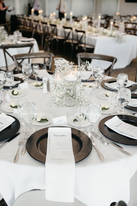 Wedding Tablescapes Round Black And White, Black Wedding Chargers, Black Table Runner Wedding Round Table, Black Rimmed Charger Plate Wedding, Black Linen Napkins Wedding, Black Plate Chargers Wedding, Black Charger Plates Wedding Table Settings, White Table With Black Runner, White Charger Plates Place Settings