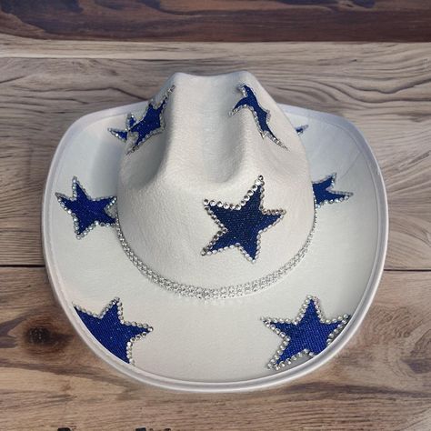 CHILD'S Blue Star Rhinestone Cowboy Hat. This cowboy hat is the perfect addition to your party, events, and even cute photos! This is a child-sized, polyester cowboy hat sealed with blue glitter stars with outlined silver rhinestones and a double rhinestone band. The glitter is only on the top of the hat ensuring that it will not get in your hair! The base and bottom of the hat is white. The glitter has been sealed so it will not easily come off! We hope you will love this stunning hat as much as we do! You can customize this hat with any color glitter you want just message us or put it in the personalization section! Please message us if you have any questions or are interested in ordering a large quantity. There are NO RETURNS for our hats. Love,  The Disco Cowgirls💋 Bejeweled Cowgirl Hat, Custom Cowgirl Hats With Rhinestones, Cow-boy Hat, Hoco Cowboy Hats, Bedazzled Cowgirl Hat Diy, Badazzel Cowboy Hat, Diy Rhinestone Hat, Rhinestone Cowboy Hats, Painted Cowboy Hats Ideas