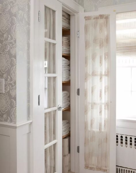 Line glass closet doors with fabric for some extra privacy—and add style, too. You'll be less worried about everyone seeing the state of your shelves while walking around your home and can enjoy a fun pattern; it's a win-win. This type of setup is particularly popular in traditional or grandmillennial style homes. Curtains Closet Door Bedrooms, Closet Curtain Ideas, Gold And White Curtains, Cozy Curtains, Off White Curtains, Curtains For Closet Doors, Closet Curtain, Glass Door Curtains, Little Spaces