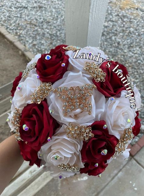 An elegant and beautiful bouquet! Customize bouquets are also available if needed. Different colors and brooches. 10inches in diameter You are welcome to message me and I will reply quick :) Hablo español 😊 Wedding Bouquets Red And Gold, Red Quince Ramo, Red Quince Bouquet, Quince Bouquet, Ramo Bouquet, Quinceanera Flowers, Charro Theme, Quinceanera Bouquet, Red Gold Wedding