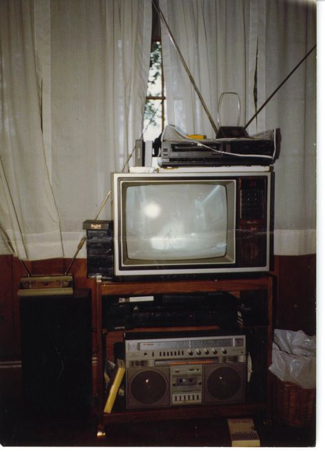 Semi-state-of-the-art home theater set-up, early 1980s. Two VHS decks to copy rental movies. Stereo VCR routed to boombox routed to speakers for "Hi-fi" sound. 19" TV with LCD display. No using the pliers to change channels on this setup! 1980s Tv Set, 70s Movie Theater Aesthetic, Vhs Home Video Aesthetic, Vhs Tv Aesthetic, 80s Tv Aesthetic, Early 80s Aesthetic, 70s Home Office, Vcr Aesthetic, Vhs Tv