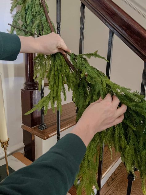 A quick tutorial to show how to hang Christmas garland on stairs, plus a modern traditional entryway Christmas decor tour. Hang Garland On Stairs, Modern Traditional Entryway, Garland On Stairs, Bannister Garland, Stairs Entryway, Stairway Garland, Banister Garland, Christmas Garland Staircase, Christmas Garland On Stairs