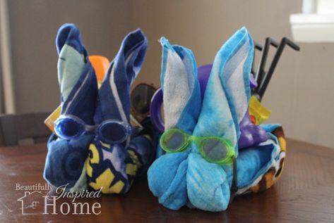 Easy tutorial to make your own beach towel Easter bunny basket. All you need is a towel, rubber band, and goggles to make this cute Easter gift. Beach Towel Easter Basket, Towel Easter Baskets, Charity Ideas, Creative Easter Baskets, Easter Bunny Basket, Bunny Basket, Easter Basket Diy, Diy Basket, Sweet Summertime