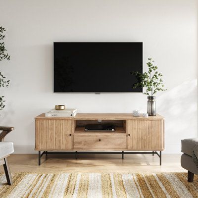 Step into a world where functionality meets elegance with the Brockie TV Stand Media Console. As you approach, the soft glow of the light wood grain finish captures your attention, hinting at the cinematic experiences and entertainment moments this piece will soon hold. The gentle curve of the tambour paneled doors beckons, a testament to the craftsmanship and intricate design that went into creating this entertainment masterpiece. The Brockie becomes more than just a TV stand positioned in your Golden Oak Tv Stand, Tv Stand With Storage, Tv Stand Wood, Tv Console, Media Console, Living Room Inspo, Entertainment Space, Living Room Tv, Home Entertainment