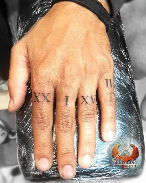 Roman Numerals Finger Tattoo, Roman Numeral Tattoo On Finger, Greek Mythology Finger Tattoos, Date On Finger Tattoo, Numbers On Fingers Tattoo, Roman Numeral Hand Tattoo, Greek Numbers Tattoo, Roman Numeral Tattoo Finger, Finger Tattoos Numbers