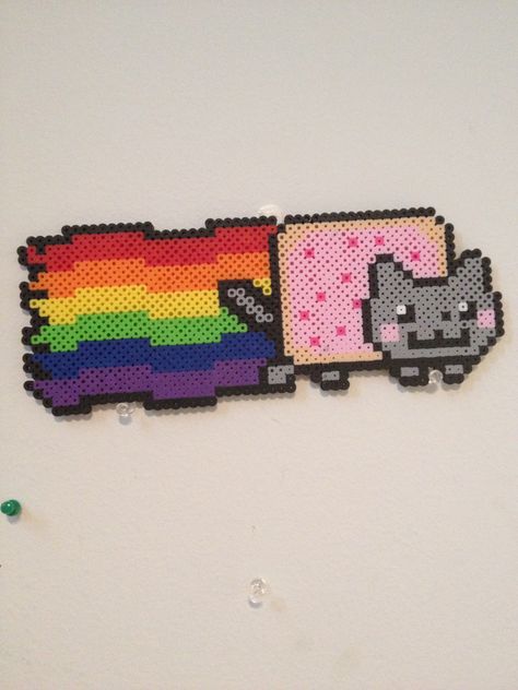 Nyan Cat perler beads by Heather Lamb Perler Beads Ideas Cat, Pusheen Cat Perler Beads, Emo Diy, Nyan Cat Perler Beads Pattern, Kitten Perler Bead Patterns, Perler Bead Nyan Cat, Nyan Cat Kandi Pattern, Neon Cat, Melt Beads Patterns