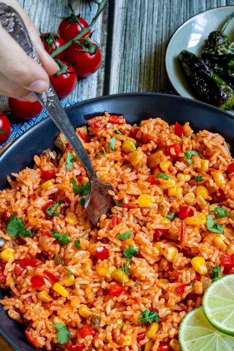 A Mexican-style dinner isn't Mexican-style without this fluffy and flavorful Mexican fried rice! This easy recipe comes together in just half an hour and is made with basmati rice, flavorful tomato puree, and various herbs, spices, and veggies. Serve it piping hot with lime wedges for an aromatic, flavor-packed side dish or entree that the whole family will love! Fried Rice Vegan, Mexican Fried Rice, Mexican Fries, Chili Rice, Mexican Rice Recipes, Mexican Side Dishes, Tomato Rice, Tomato Puree, Light Meals