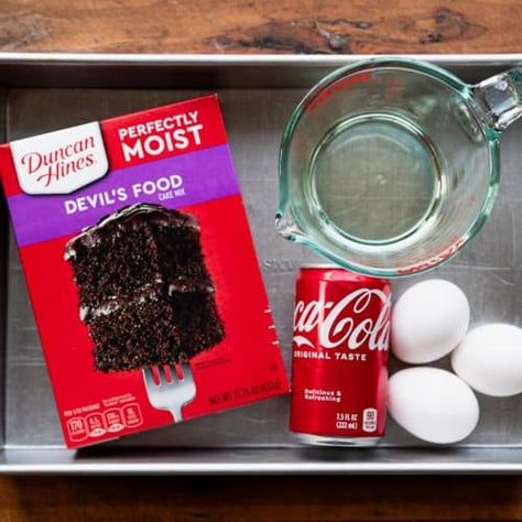 This Coca Cola cake is a classic Southern dessert made easy -- thanks to help from a box of cake mix! A homemade fudgy pecan and Coca Cola frosting coats each decadent slice of the moist and fluffy chocolate cake. Chocolate Box Cake Mix Recipes, Chocolate Coke Cake, Cocoa Cola Cake, Chocolate Coca Cola Cake, Chocolate Box Cake, Coke Cake, Fluffy Chocolate Cake, Cocoa Cola, Recipes Using Cake Mix