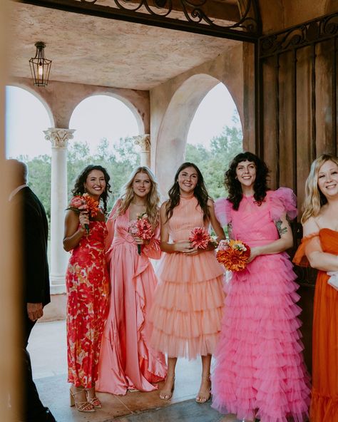 Bridemaids Colorful Dresses, Fun Bridesmaids Dresses, Groomsmen With Mismatched Bridesmaids, Mismatched Bright Bridesmaid Dresses, Red Pink Bridesmaid Dresses, Maximalist Bridesmaid Dresses, Pink And Red Bridesmaids, Bright Floral Bridesmaid Dresses, Mix And Match Bridesmaid Dresses Summer