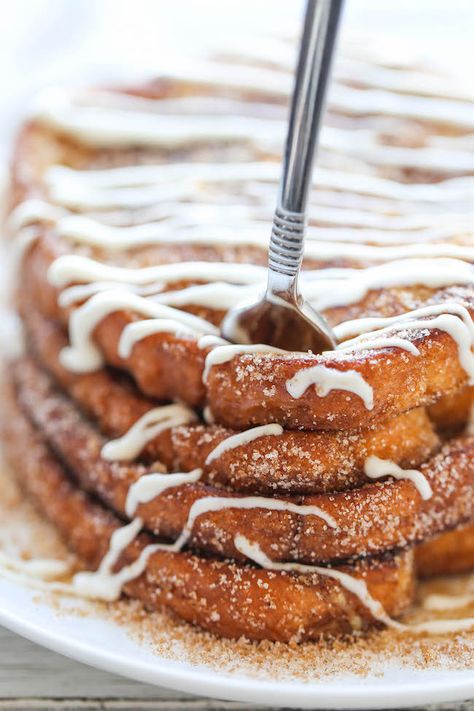 Churro French Toast - The most amazing, most buttery French toast you will ever have, coated in cinnamon sugar and drizzled with an epic cream cheese glaze! Churro French Toast, Creative Meals, French Foods, French Toast Waffles, God Exists, Breakfast Rolls, Breakfast Meals, Break Fast, Cream Cheese Glaze