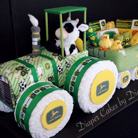 Diana on Instagram: “A John Deer inspired tractor and wagon diaper cake created with John Deere baby items, diapers, fleece blanket and waterproof Change Pad…” Diaper Tractor, Tractor Diaper Cake, Cake Tractor, Diaper Cake Ideas, Tractor Baby Shower, John Deere Baby, Unique Diaper Cakes, Diy Diaper Cake