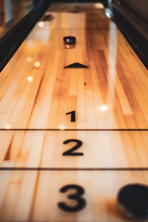 Shuffleboard is a popular game played on a very long and expansive table, which most people would struggle to fit in their home. The regulation size table for this game is 22 feet long and 30 inches wide; however, you can get much smaller varieties so that you can play shuffleboard in the comfort of your own home. Diy Shuffleboard Table, Aesthetic Game Room, Closet Rod Height, Shuffle Boards, Shuffle Board, Painted Closet, Shuffleboard Tables, Craft Food, Shower Plumbing