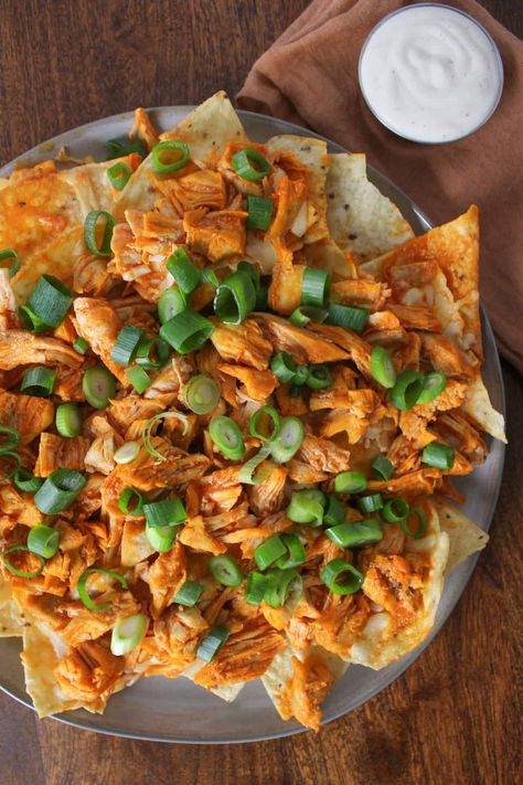 Make these 7-ingredient loaded buffalo chicken nachos in 20 minutes for an easy, protein-heavy game day snack or dinner. Light Ranch Dressing, Buffalo Chicken Nachos, Chicken Nachos Recipe, Homemade Nachos, Group Food, Easy Protein, Chicken Nachos, Game Day Snacks, Winter Recipes