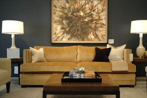 The gorgeous sofa and the rather unique painting on the wall have added plenty of charm to the decor of this room. Don't you think so? Gray And Navy Living Room, Brown And Gray Living Room, Gray And Brown Living Room, Navy Living Room Ideas, Gold Couch, Gold Living Room Decor, Glam Living Room Decor, Gold Sofa, Gorgeous Sofas