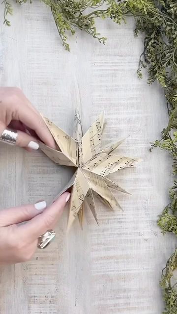 gina luker | arts + crafts on Instagram: "Of all the paper stars I make, these are my favorite. They have that little extra level that just makes them feel more festive. And if you don’t want to use real sheet music or book pages, they’re beautiful with regular scrapbook paper, too. Hopefully I’ll have heat in my studio today so I can get back to work, but in the meantime, I hope you enjoy this rewind from last year ⭐️" Crafts With Sheet Music Book Pages, Book Page Stars, Origami Paper Stars, Sheet Music Crafts, Sheet Music Art, Christmas Sheet Music, Christmas Stars, Music Crafts, Music Paper