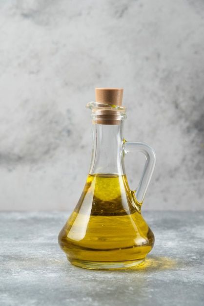 Olive oil bottle on marble table. | Free Photo #Freepik #freephoto #cooking-oil #oil-bottle #olive-oil #oil Vegetable Oil Substitute, Cooking Oil Bottle, Oil Substitute, Salad Vegetables, Castor Oil Packs, Olive Oil Bottle, Vinegar Dispenser, Vinegar Cruet, Olive Oil And Vinegar