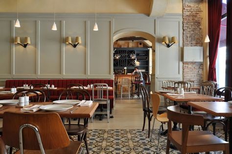 la bonn bouche bistro; red upholstered banquette + cast iron tables + cement tiles + tom dixon wall lamps + various chairs + gray + bricks + blue Bistro Interior Design, Bistro Interior, Bistro Design, Bistro Restaurant, Cafe Concept, French Restaurant, 카페 인테리어 디자인, Cafe Bistro, French Cafe