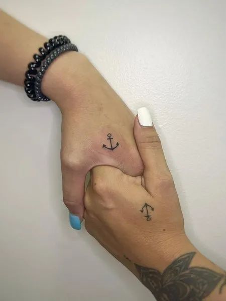 23 Heartwarming Aunt-Niece Tattoo Ideas: Celebrating the Unbreakable Bond Anchor Matching Tattoos Couple, Matching Anchor Tattoos For Couples, Hawaii Couple Tattoos, Anchor Family Tattoo, Anchor Tattoo Couples, Small Anchor Tattoos For Women Simple, Anchor Couple Tattoos, 3 Person Tattoo Family, Small Anchor Tattoos For Women