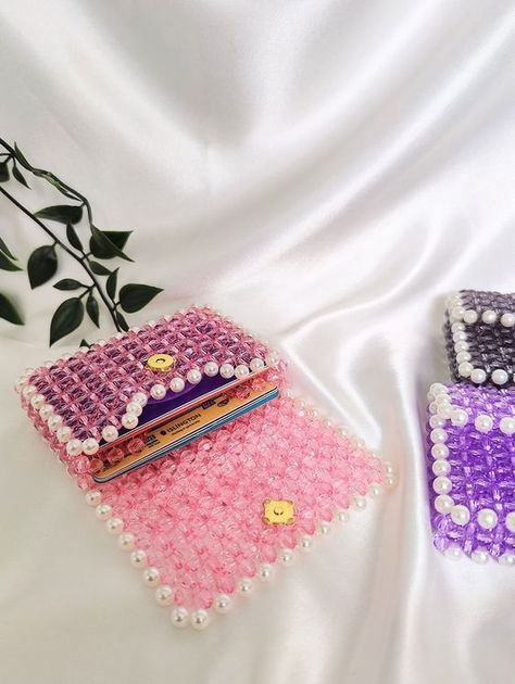 Hi!🌸 Welcome to my store!✨ These sparkly beaded card holders are both functional and stylish. Compact and sleek, each card holder is meticulously handcrafted. Available in vibrant colours, the beads create a visually stunning effect that is sure to turn heads and spark conversations wherever you go. Designed to accommodate your essential cards, such as credit cards, IDs, and business cards. Beaded Cards, Beaded Animals Tutorial, Beads Bag, Hand Beaded Bag, Diy Crafts Love, Jewelry Store Design, Crochet Baby Shoes Pattern, Diy Bags Patterns, Beaded Boxes