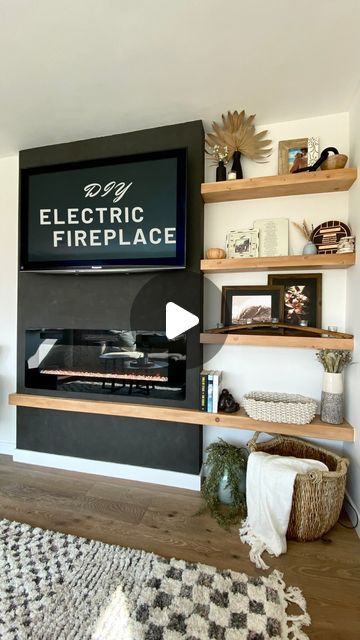 Gabrielle Bourne | Actress & Builder on Instagram: "Part 1 of my DIY electric fireplace + floating shelves build 😍. When your living room is small so you can’t afford to lose any space with a built in, these floating shelves are a great option to create interest!! Follow so you don’t miss part 2 where I show you how I built these floating shelves. 
  ⠀⠀⠀⠀⠀⠀⠀⠀⠀⠀⠀⠀
#girlswhobuild #floatingshelves #portola #romanclay #blackeverything #diy #diyfireplace #doityourself" Floating Fireplace Ideas, Tv Fireplace Wall Ideas Built Ins, Electric Fireplace Wall Ideas, Fireplace Floating Shelves, Diy Electric Fireplace, Electric Fireplace Wall, Living Room Built Ins, Fireplace Tv Wall, Diy Fireplace