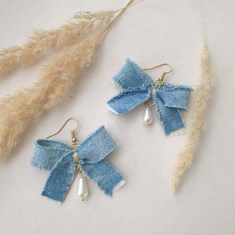 This denim earrings is a unique piece of jewelry. Blue jeans always remain on the catwalk in one form or another. This recycled denim earrings highlights the beauty of denim and is a fine example of sustainable fashion. Unique, eco-friendly, hand sewn, recycled and handmade with love, this earrings protects our planet by using reused materials. Width 2 inches Jewelry Using Recycled Materials, Recycled Materials Jewelry, Earring With Beads, Jeans Jewellery Ideas, Jewelry With Ribbon, Recycled Earrings Diy, Denim Earrings Handmade, Ribbon Earrings Diy, Hand Made Earings