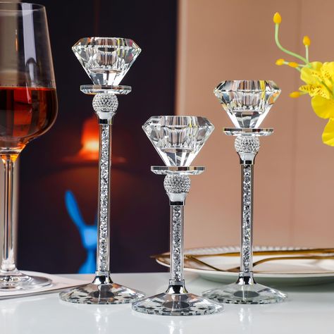 PRICES MAY VARY. Elegant Trio: Elevate your home decor with this exquisite set of three conical crystal candle holders. Each set includes candle holders of varying heights (17cm, 20cm, and 23cm) for a captivating display that adds an elegant touch to any room. Premium Quality: Crafted with precision, these candle holders are made from high-quality crystal to ensure clarity, brilliance, and a stunning interplay of light. They're designed to impress and create a sophisticated ambiance in your livi Glitz And Glam Party Centerpieces, Candle Holder Table Decor, Royal Wedding Centerpieces, Diamond Wedding Decorations, Diamond Theme Party, Bling Candle Holders, Wine Glass Centerpieces, Tall Candle Holder, Pearl Bridal Shower