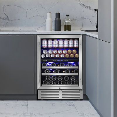 This is an outstanding wine and beverage refrigerator, featuring a reversible door, upgraded stainless steel edge shelves, adjustable feet, and captivating blue LED lighting. With its large capacity, the upper zone can hold 94 cans of 12 oz. beverages, while the lower zone can accommodate 27 bottles of 750ml wine, perfectly meeting your storage needs. Furthermore, we offer free delivery of two types of door handles, allowing you to choose based on your preference and installation requirements. | Wine Coolers Drinks, Beverage Fridge, Led Lighting Bedroom, Drapes And Blinds, Beverage Refrigerator, Lighting Bedroom, Serving Wine, Wine Wall, Bar Wall