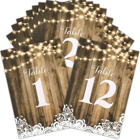 PRICES MAY VARY. Table Number Sign Set: we will provide you with 12 pieces of rustic table numbers, printed with numbers 1-12, which can meet the needs of most banquets, mark your table and make it convenient for guests to find their own position Reliable and Reusable: our wedding paper table numbers are made of quality 300 g coated paper, not easy to break or fade, which can be applied with various brackets as table decorations and table signs, and thick cardboard makes them reliable and reusab Wedding Seating Chart Table, Wood Lights, Wedding Table Seating Chart, Rustic Wedding Decor Diy, Rustic Table Numbers, Rustic Wedding Table Decor, Rustic Table Decor, Calligraphy Print, Reception Centerpieces