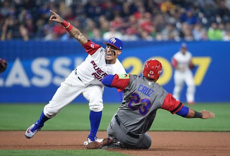 SAN DIEGO - Over the course of October and a bit of November, he dazzled Cubs' fans with his acrobatic plays at second base.  While that certainly caught the eye of baseball fans around the country, Javier Baez did so around the world with an incredible play in San Diego on Tuesday night.  As a member of team Puerto Rico at the World Baseball Classic, the second baseman made one of the plays of the tournament as he pull off a no-look tag out while celebrating in the eighth inning of his ... Javier Baez, Baseball Wallpaper, Baseball Tips, Cubs Win, Chicago Cubs Baseball, Cubs Baseball, World Baseball Classic, Baseball Equipment, Baseball Fan