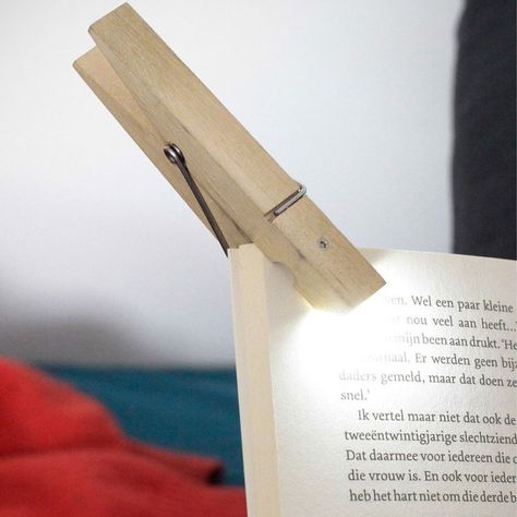 The clothespin reading light is a clip that you can attach to your book and will act as a reading light to help you read in the dark. Clip Lights, Light Clips, Clothes Pin Crafts, Book Lights, Gadgets And Gizmos, Reading Material, Reading Lamp, Reading Light, Travel Gifts