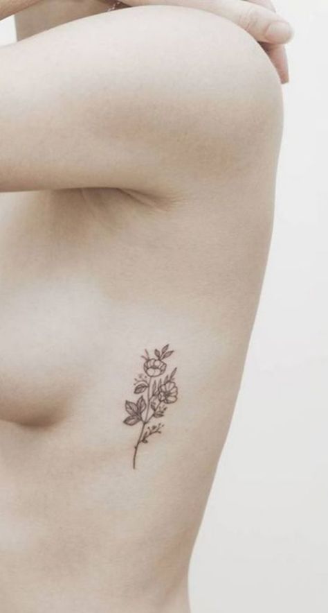 10 Of The Coolest Tattoo Designs You Should Totally Get - Society19 Flower Rib Tattoo, Tattoo Costillas, Rib Tattoo Ideas, Flower Tattoo On Ribs, Flor Tattoo, Flower Tattoo On Side, Sunflower Tattoo Shoulder, Sunflower Tattoo Small, Tattoos For Women Flowers