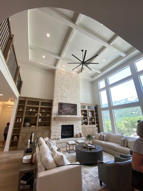 Living Room Half Vaulted Ceiling, Two Story Family Room Lighting, Two Story Living Room Ceiling Fan, Tall Ceiling Living Room Fan, Open To Above Living Room Fireplaces, Ceiling Fan In Vaulted Living Room, Living Room 2 Story Ceiling, High Ceiling Living Room Fan, Tall Ceiling Living Room Lighting