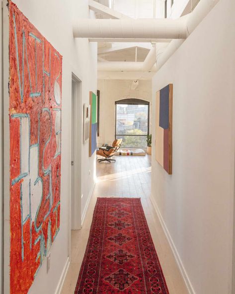 Bright Philadelphia Rental Apartment Filled with Art | Apartment Therapy Hallway With Artwork, Artwork Hallway, Penthouse Modern, Impressive Art, Red Artwork, Red Runner, Furniture Handmade, Empty Spaces, Modern City