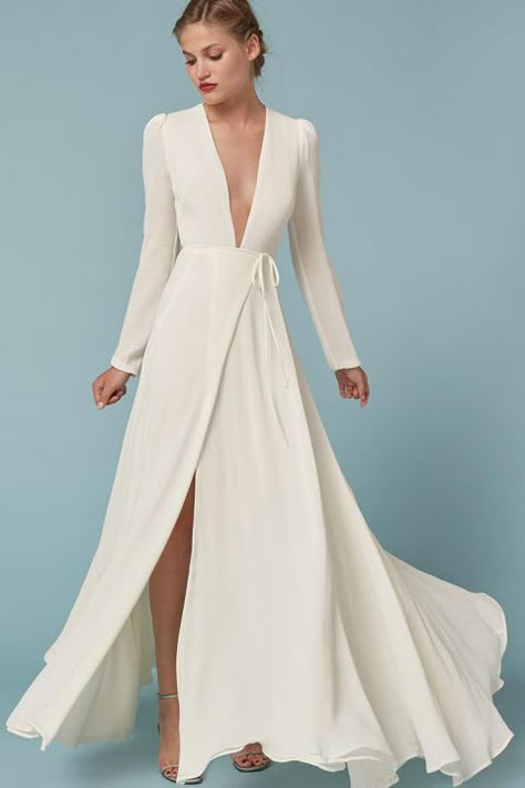 Low-key brides will love Reformation wedding gowns. The brand best known for effortlessly cool, eco-friendly dresses is now in the bridal game with designs like this one. The flattering wrap style and plunging V-neck are perfect for nuptials with a bohemian theme. (We're also obsessed with this one.) High Street Wedding Dresses, Winter Wedding Gowns, Eco Friendly Dress, Bridal Games, Affordable Wedding Dresses, Long White Dress, Dress With Long Sleeves, Winter Wedding Dress, Moda Vintage